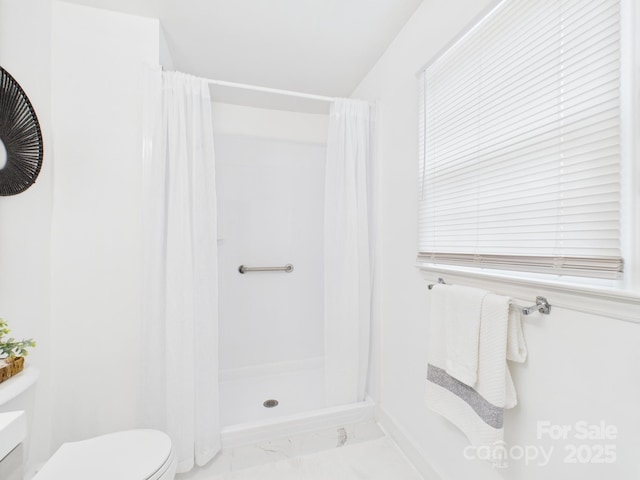 4905 Chestnut Lake Dr, Charlotte, NC 28227 - bathroom with toilet, marble finish flooring, curtained shower, and baseboards