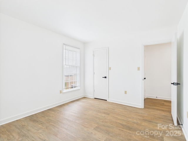 4905 Chestnut Lake Dr, Charlotte, NC 28227 - spare room with light wood-type flooring and baseboards