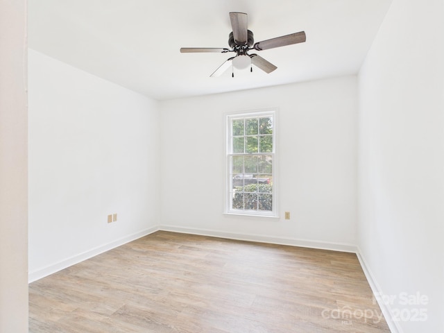 4905 Chestnut Lake Dr, Charlotte, NC 28227 - spare room featuring light wood-type flooring, baseboards, and ceiling fan