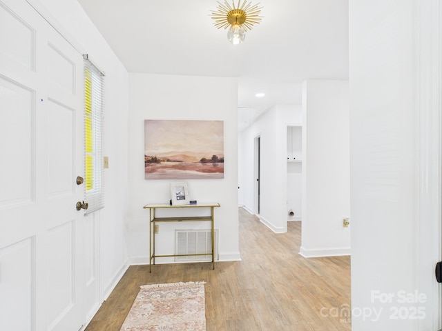 4905 Chestnut Lake Dr, Charlotte, NC 28227 - entryway featuring wood finished floors and baseboards