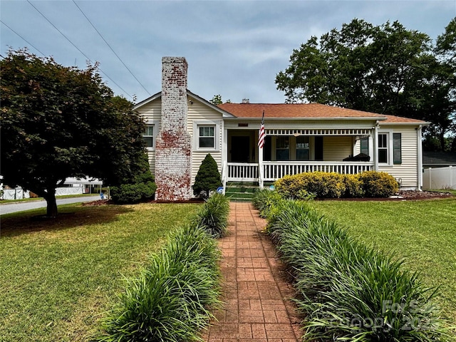 522 W Congress St, Lincolnton, NC 28092 - view of front of house featuring a porch, a front lawn, and a chimney