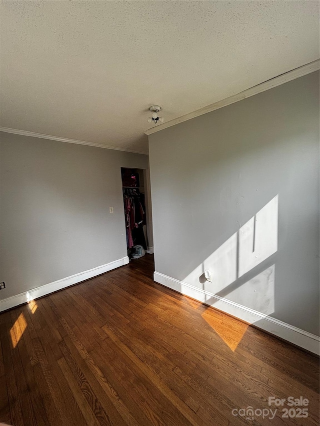 522 W Congress St, Lincolnton, NC 28092 - empty room featuring crown molding, baseboards, wood finished floors, and a textured ceiling