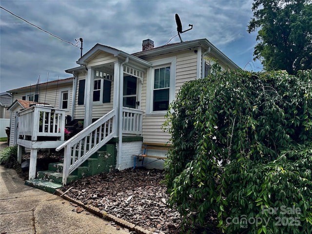 522 W Congress St, Lincolnton, NC 28092 - rear view of house featuring a chimney and a wooden deck