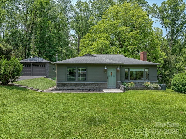 90 W Skyland Cir Unit 1, Asheville, NC 28804 - view of front of property featuring a chimney, a detached garage, a front yard, an outdoor structure, and stone siding