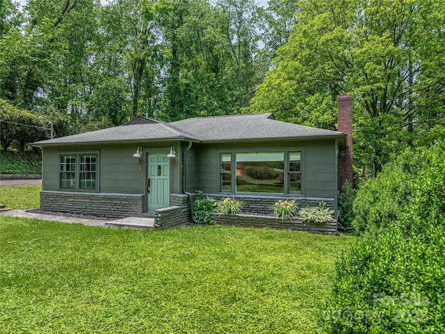 90 W Skyland Cir Unit 1, Asheville, NC 28804 - view of front facade with a front yard, a chimney, stone siding, and a shingled roof