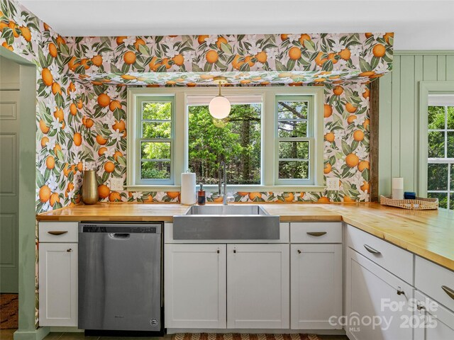 90 W Skyland Cir Unit 1, Asheville, NC 28804 - kitchen with dishwasher, wooden counters, wallpapered walls, a sink, and white cabinetry