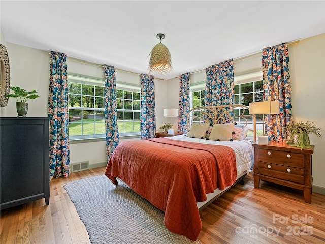 90 W Skyland Cir Unit 1, Asheville, NC 28804 - bedroom featuring wood finished floors and baseboards