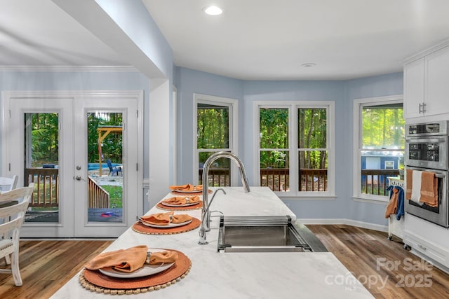 5317 Black Oak Ln Unit 11, Waxhaw, NC 28173 - dining space with wood finished floors, french doors, baseboards, recessed lighting, and ornamental molding