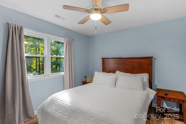 5317 Black Oak Ln Unit 11, Waxhaw, NC 28173 - bedroom featuring wood finished floors, a ceiling fan, and baseboards
