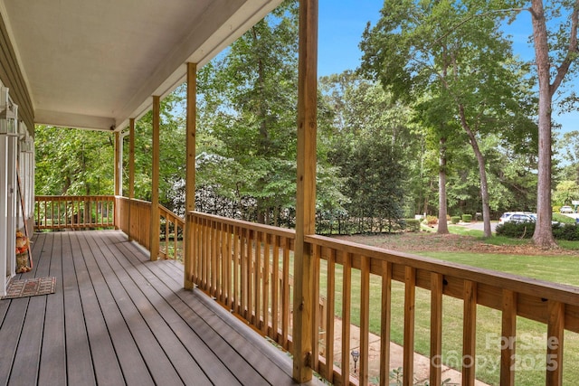 5317 Black Oak Ln Unit 11, Waxhaw, NC 28173 - wooden porch featuring a yard and view of wooded area