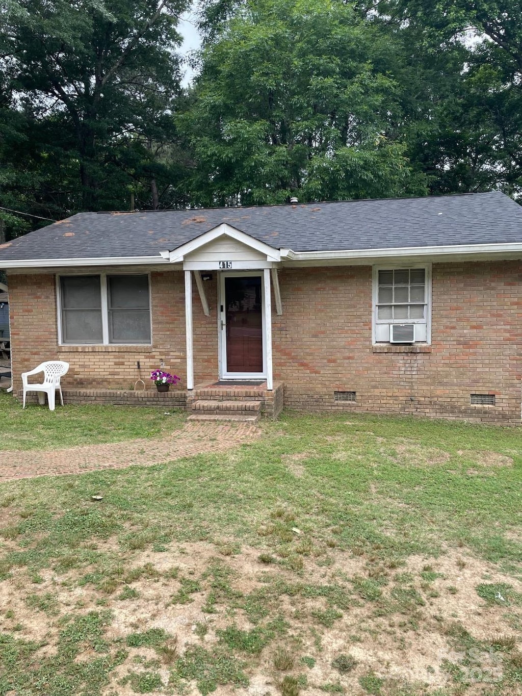 415 N Secrest Ave, Monroe, NC 28110 - ranch-style house featuring crawl space, a front lawn, and brick siding