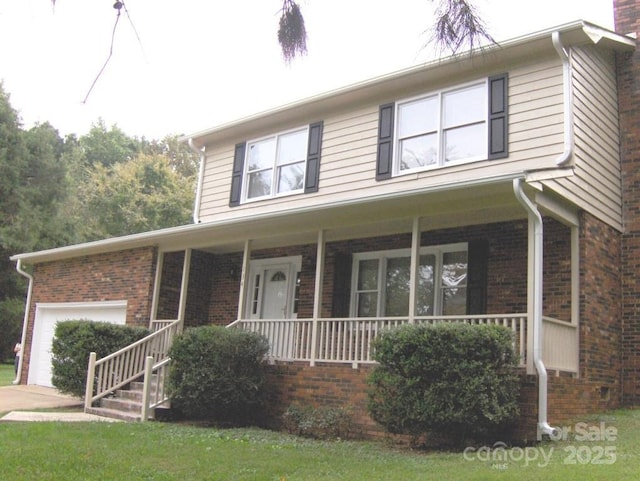 134 Crystal Cir, Mooresville, NC 28117 - view of front of house featuring covered porch, an attached garage, brick siding, and a chimney