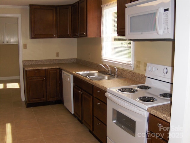 134 Crystal Cir, Mooresville, NC 28117 - kitchen with white appliances, a sink, light tile patterned flooring, light countertops, and dark brown cabinets