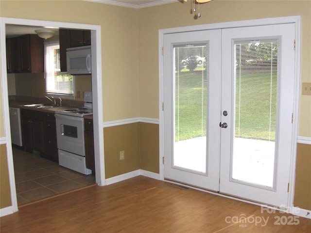 134 Crystal Cir, Mooresville, NC 28117 - kitchen featuring white appliances, french doors, a sink, dark wood-style flooring, and crown molding
