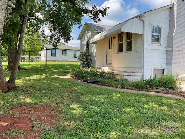 2138 SW Haven Cir, Lenoir, NC 28645 - view of side of home featuring a yard