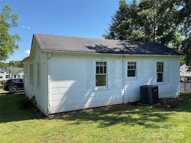 2138 SW Haven Cir, Lenoir, NC 28645 - view of property exterior with central AC, a shingled roof, and a lawn