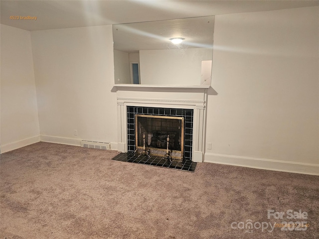 4520 Bradbury Dr, Charlotte, NC 28209 - unfurnished living room with carpet, a tiled fireplace, and baseboards
