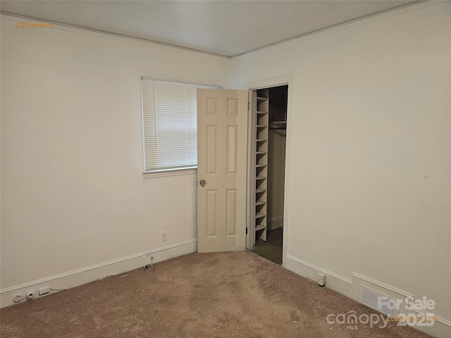 4520 Bradbury Dr, Charlotte, NC 28209 - unfurnished bedroom with carpet floors, crown molding, and a closet