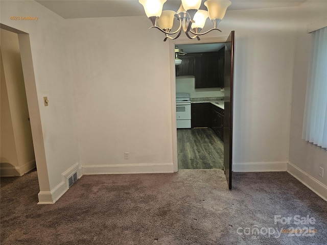 4520 Bradbury Dr, Charlotte, NC 28209 - unfurnished dining area with dark colored carpet, a chandelier, and baseboards