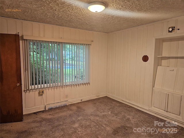 4520 Bradbury Dr, Charlotte, NC 28209 - carpeted empty room featuring wooden walls