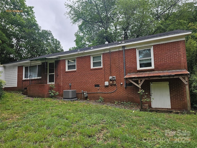4520 Bradbury Dr, Charlotte, NC 28209 - rear view of property with a yard, brick siding, and cooling unit