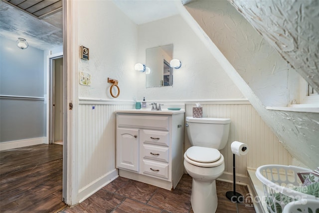 15 Wilson Way, Flat Rock, NC 28731 - half bathroom featuring vanity, a wainscoted wall, and wood finished floors