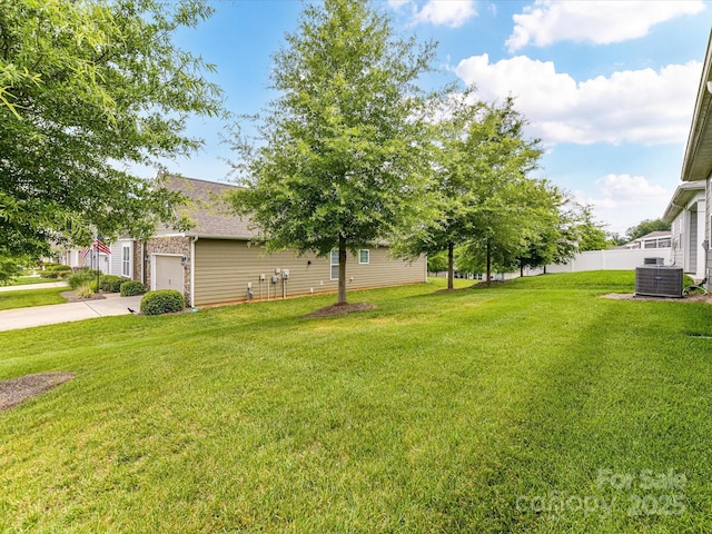 505 Belle Grove Dr, Lake Wylie, SC 29710 - view of yard featuring cooling unit, an attached garage, and driveway