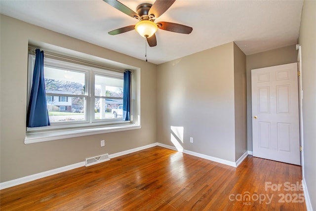 15 Oak Leaf Ln, Arden, NC 28704 - spare room with wood finished floors, baseboards, and ceiling fan