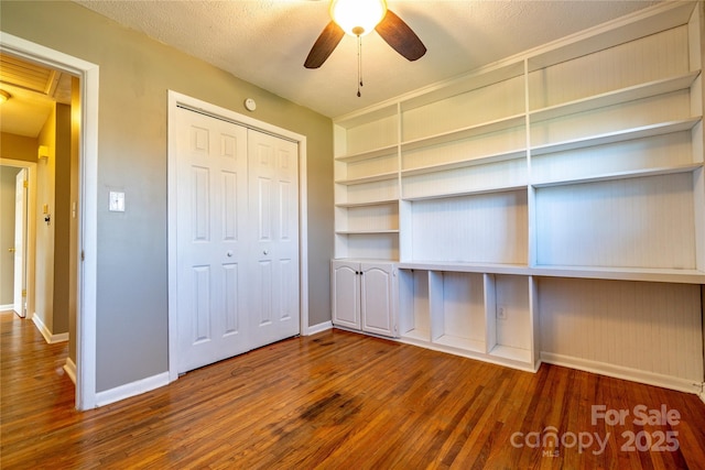 15 Oak Leaf Ln, Arden, NC 28704 - unfurnished bedroom with baseboards, wood finished floors, and a closet