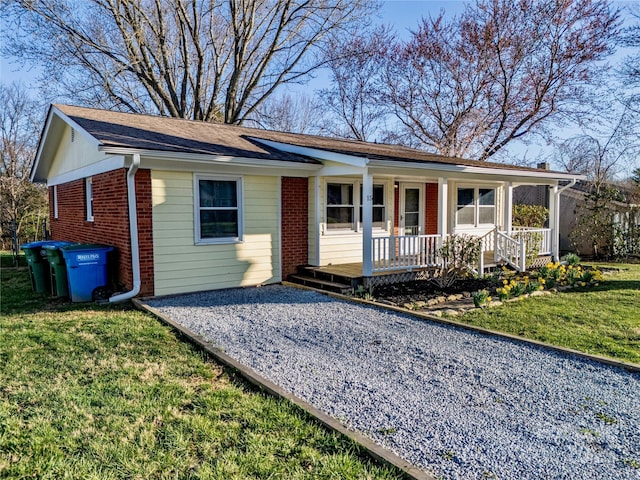 15 Oak Leaf Ln, Arden, NC 28704 - ranch-style house featuring a porch, brick siding, and a front yard