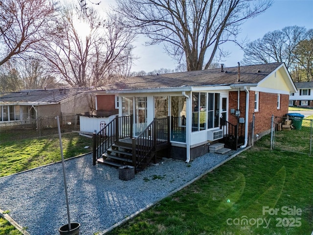 15 Oak Leaf Ln, Arden, NC 28704 - ranch-style home with brick siding, cooling unit, and a sunroom