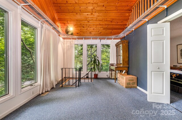 1102 Lake Montonia Rd, Kings Mountain, NC 28086 - unfurnished room with wood ceiling, carpet, plenty of natural light, baseboards, and an upstairs landing