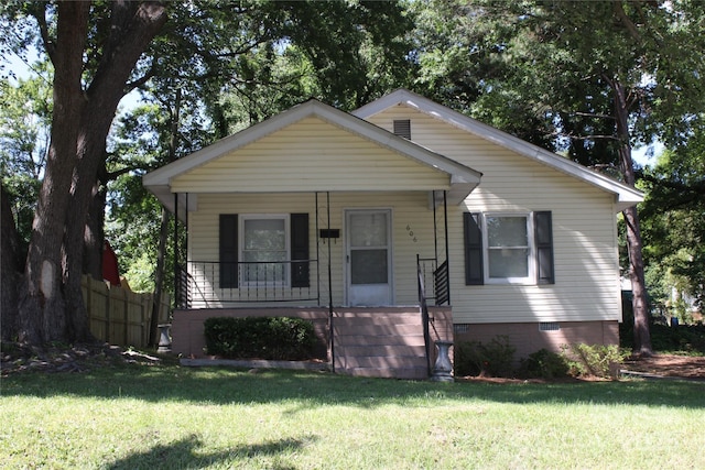 606 E 4th Ave, Gastonia, NC 28054 - bungalow featuring a porch, a front lawn, and crawl space