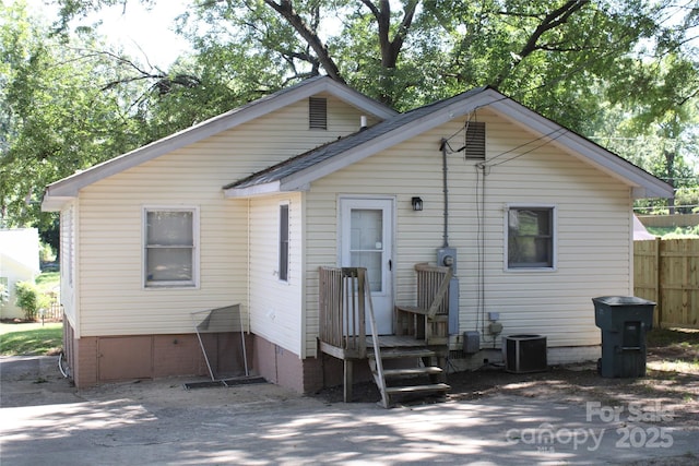 606 E 4th Ave, Gastonia, NC 28054 - back of house featuring central air condition unit and crawl space