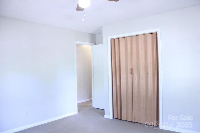 606 E 4th Ave, Gastonia, NC 28054 - unfurnished bedroom with carpet, a closet, baseboards, and ceiling fan