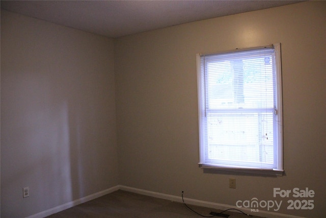 606 E 4th Ave, Gastonia, NC 28054 - spare room with baseboards and carpet