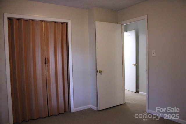606 E 4th Ave, Gastonia, NC 28054 - unfurnished bedroom featuring light carpet and baseboards