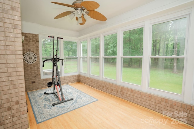 1565 Earnhardt Rd, Salisbury, NC 28146 - exercise room with brick wall, wood finished floors, and ceiling fan