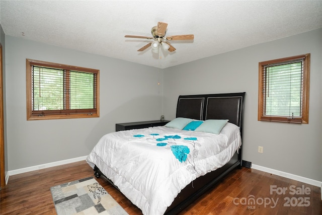 1565 Earnhardt Rd, Salisbury, NC 28146 - bedroom with baseboards, multiple windows, wood finished floors, and a textured ceiling