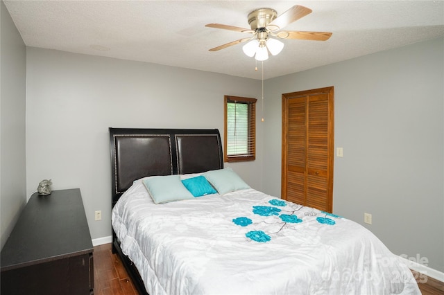 1565 Earnhardt Rd, Salisbury, NC 28146 - bedroom with dark wood-style floors, baseboards, a closet, and a ceiling fan