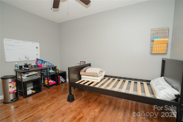1565 Earnhardt Rd, Salisbury, NC 28146 - bedroom featuring wood finished floors and a ceiling fan
