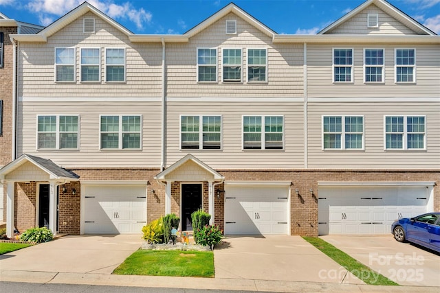 117 Langhorne Dr, Mount Holly, NC 28120 - townhome / multi-family property with brick siding, driveway, and an attached garage
