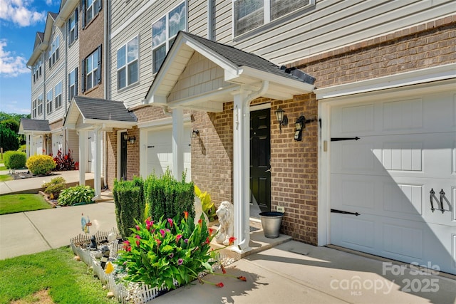 117 Langhorne Dr, Mount Holly, NC 28120 - property entrance featuring brick siding and an attached garage