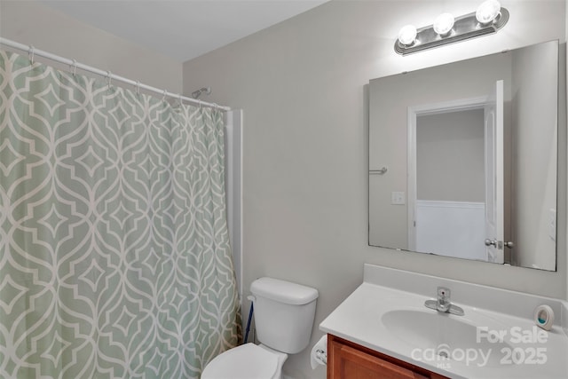 117 Langhorne Dr, Mount Holly, NC 28120 - bathroom featuring vanity, toilet, and a shower with curtain