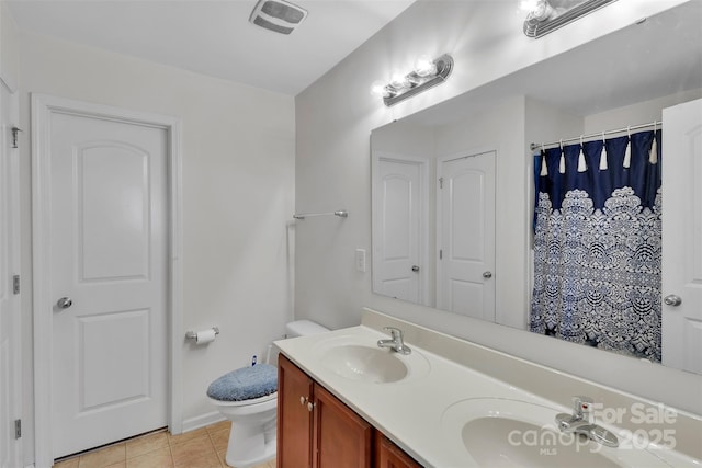 117 Langhorne Dr, Mount Holly, NC 28120 - full bath with double vanity, tile patterned flooring, toilet, baseboards, and a shower with curtain