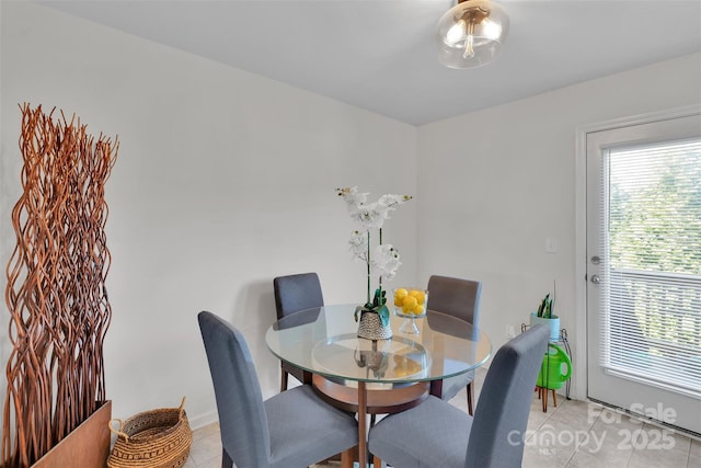 117 Langhorne Dr, Mount Holly, NC 28120 - dining area with light tile patterned floors and baseboards