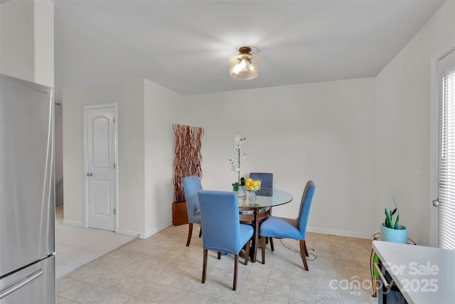 117 Langhorne Dr, Mount Holly, NC 28120 - dining room featuring light tile patterned floors and baseboards