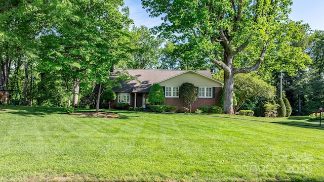 220 W Park Dr, Morganton, NC 28655 - single story home featuring a front yard and brick siding