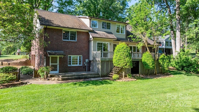 220 W Park Dr, Morganton, NC 28655 - rear view of house featuring a yard, a wooden deck, and brick siding