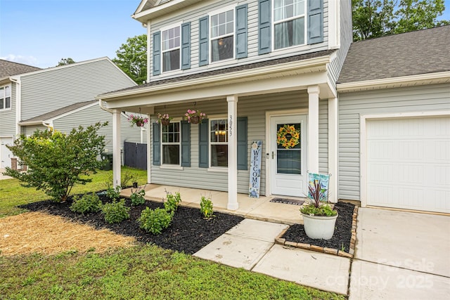 3053 Riker St, Clover, SC 29710 - view of exterior entry with covered porch, a shingled roof, and a garage